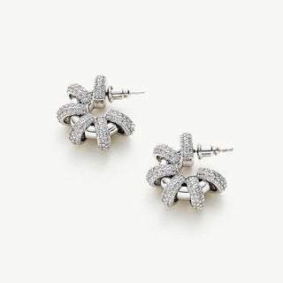 Coiled Single Earrings, featuring a singular coil design, these earrings exude elegance with a modern twist, adding a touch of sophistication to your ear ensemble