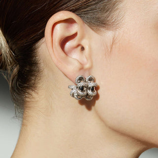 Coiled Double Earrings with sculptural twists, these earrings make a bold and artistic statement, capturing attention with their unique and eye-catching design.