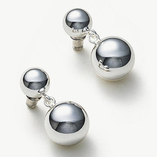 Hoop Earrings with Double Spheres, a contemporary and chic design that adds a touch of modernity and style to your ensemble