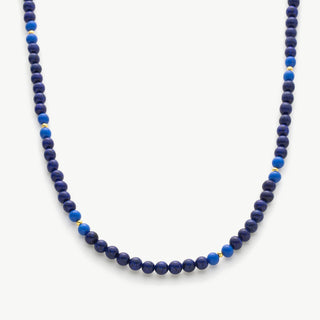 Lapis Blue Necklace, a captivating piece inspired by the deep blue hues of the ocean, featuring a lapis lazuli pendant suspended from a delicate chain for a touch of maritime elegance