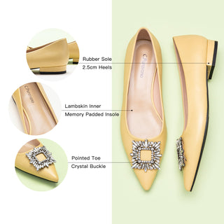 Step into sophistication with these yellow flats featuring a crystal buckle, perfect for a polished and refined look.