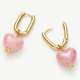 Ceramics Heart Hoop Earrings in Pink, offering a chic and elegant accessory that seamlessly combines ceramics with the timeless allure of pink