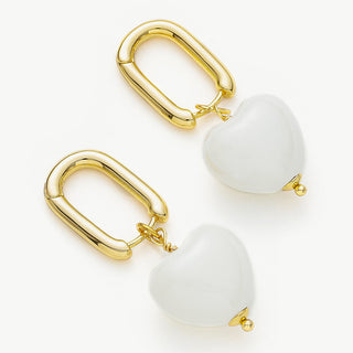 Heart Hoop Earrings in Ivory White Ceramics, showcasing an affectionate and stylish combination of heart shapes and ivory tones for a unique look