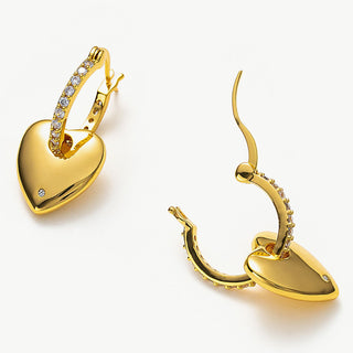 Golden Heart Crystal Charm Hoop Earrings, showcasing glamorous golden hearts and sparkling crystals, making a bold statement of love and style.