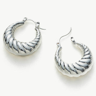 Dome Ridge Hoop Earrings, adorned with a contemporary dome charm, these earrings blend modernity with sophistication, creating a versatile and stylish accessory.