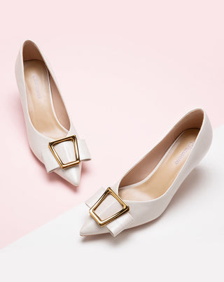Elegant-white-pumps-featuring-buckles_-adding-a-touch-of-sophistication-and-style
