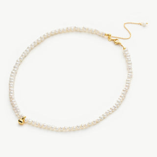 Gold Pearl Pendant Choker, a luxe embrace of pearls and gold, this choker features a carefully crafted pearl pendant suspended from a gold chain, making it a sophisticated and romantic addition to your jewelry collection